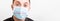 Portrait of young shocked sick man in medical mask with coronavirus word at white background. Respiratory protection. Coronavirus