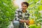 Portrait young smart farmers and entrepreneurs happy garden,checking quality and take care of melon products,fresh organic in