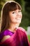 Portrait of young smiling girl with bordeaux shawl