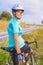 Portrait of young smiling happy female caucasian cyclist athlete