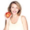 Portrait of a young smiling healthy woman with apple