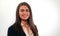 Portrait of young smiling woman in business suit on white background