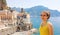 Portrait of young smiling woman with sunglasses in Atrani village, Amalfi Coast, Italy. Picture of female tourist in her summer