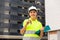 Portrait of a young smiling woman working as a process engineer, demonstrating the keys