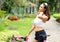 Portrait of young sport lady with pink bicycle resting after exercise