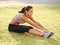 Portrait of Young Sporty Woman Doing Stretching Exercise. Athletic Workout.