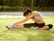 Portrait of Young Sporty Woman Doing Stretching Exercise. Athletic Workout.
