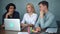 Portrait of young startup business men and woman discuss together in front of laptop in office and look serious.