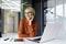Portrait of young successful business woman inside office at workplace, female worker is dreamy and pensive smiling and
