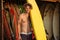 Portrait of a young surfer with surfboard