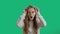 Portrait of young surprised beautiful woman in glasses on a chromakey background. Shocked girl is looking to the camera