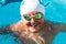 Portrait of young swim student in water.