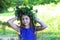 Portrait of a young teen girl in wreath of wild flowers and background of nature