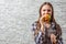 Portrait of young teenager brunette girl with long hair eating burger. Girl trying to eat fast food