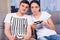 Portrait of young and trendy couple playing video game