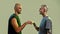 Portrait of young twin brothers with tattoos and piercings looking at each other, giving fist bump, standing face to