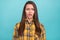 Portrait of young unsatisfied disappointed person open mouth look camera isolated on blue color background