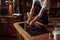 Portrait of young waiter washing his hands in kitchen at cafe