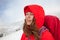 Portrait of a young woman with a backpack in the mountains.