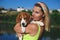 Portrait of a young woman with a beagle puppy in her arms