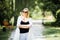 Portrait of a young woman, blonde, glasses, outdoors in the park