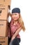 Portrait of a young woman with cardboard boxes