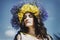 Portrait of young woman with circlet of flowers on head