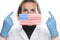 Portrait of a young woman doctor with medical protective mask with the image of the flag of United States of America USA. Crisis