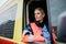 Portrait of young woman doctor sitting in ambulance car.