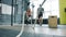 Portrait of young woman doing crossfit ropes battling exercise working out with trainer