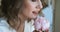 Portrait of young woman with flower, tender and romantic model holds peony.