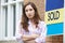 Portrait Of Young Woman Forced To Sell Home Through Financial Pr