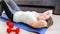 Portrait of young woman hardly breathing after doing sit-ups