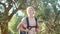 Portrait of young woman hiking in countryside. Concept of adventure, freedom, orienteering.