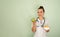 Portrait of young woman nutritionist in medical gown.