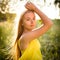 Portrait of young  woman  outdoor on a spring/summer sunny day