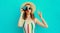 Portrait of young woman photographer with vintage film camera blowing red lips sending sweet air kiss wearing a summer straw hat