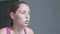 Portrait of young woman riding at stationary bike at the gym in slow motion