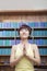 Portrait of young woman with short hair doing yoga with hands clasped together in front