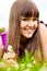 Portrait of young woman with small bouquet