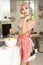 Portrait of a young woman stirring food in bowl in kitchen