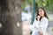 Portrait young woman thinking and looking modern style in outdoor urban background