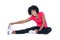 Portrait of young woman touching toes while exercising