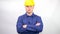 Portrait of a young worker,head of a construction company,on a white background,a worker in a construction helmet.
