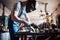 Portrait of a young worker at a large metalworking plant. The welder engineer works in a protective mask