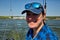 Portrait of a young yachtswoman driving a yacht.