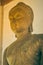 Portrait Zoom View Front Left Buddha Statue in Sanctuary in Vintage Tone