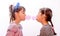 Portraits of beautiful little girls blowing bubbles