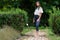 Portraits of a beautiful young girl in a green garden