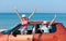 Portraits of joyful sisters on the beach in the car.